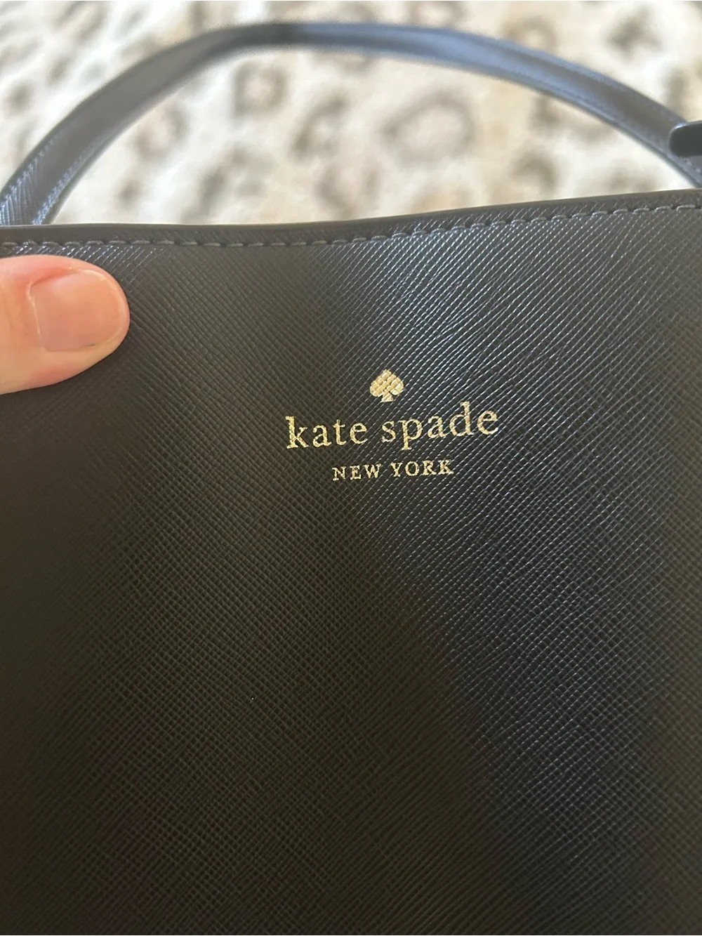 kate spade black leather tote with luggage tag charm